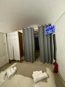 TV a/nebo společenská místnost v ubytování Le Ninfe del Mare + 37 fotografií