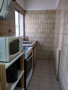 Η κουζίνα ή μικρή κουζίνα στο DEPARTAMENTO BALMAR a 400mt de la playa +5 φωτογραφίες
