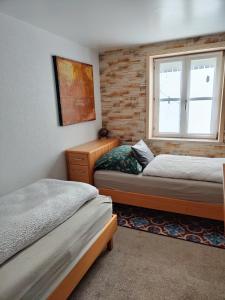 Postel nebo postele na pokoji v ubytování Gemütliches 2 Bettzimmer mit Gemeinschaftsbad und kleiner Küche