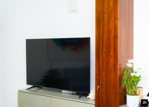 TV a/nebo společenská místnost v ubytování Beach Symphony