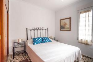 Postel nebo postele na pokoji v ubytování Gran Jardín frente al mar