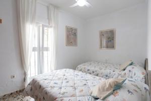 Postel nebo postele na pokoji v ubytování Gran Jardín frente al mar + 20 fotografií