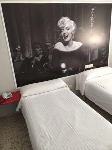 Postel nebo postele na pokoji v ubytování Hotel Sur Utopia