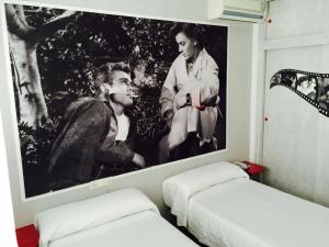 Postel nebo postele na pokoji v ubytování Hotel Sur Utopia