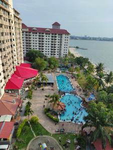 an aerial view of a resort with a swimming pool at Jev Penthouse in Port Dickson