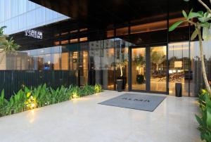 a lobby of a building with a sign that reads alma at ALMA Hotel Riyadh in Riyadh
