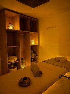 a bedroom with a bed with towels on it at Villa La Falaise in Oualidia