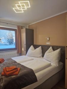 Postel nebo postele na pokoji v ubytování Appartementhaus Hüttenberger