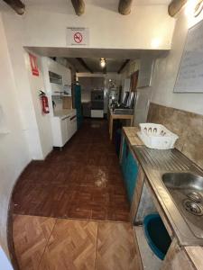 Kuchyň nebo kuchyňský kout v ubytování Intihuatana Hostel