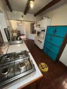 Kuchyň nebo kuchyňský kout v ubytování Intihuatana Hostel