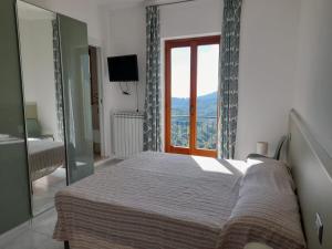Postel nebo postele na pokoji v ubytování La Casa in Vigna