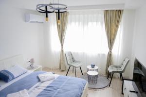 Ένα ή περισσότερα κρεβάτια σε δωμάτιο στο Aurora Apartment