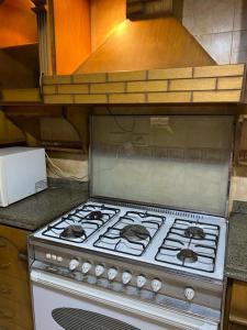 a stove top oven sitting in a kitchen at Z m abartment hotel in Giza +21 photos