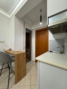 a kitchen with a sink and a counter top at Larissa city ap 7 with parking in Larisa