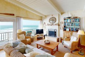 a living room with a view of the ocean at Oceanfront Dream in Cayucos