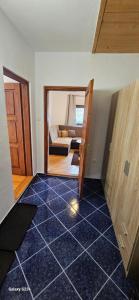 Ένα ή περισσότερα κρεβάτια σε δωμάτιο στο Apartman Alma