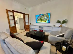TV a/nebo společenská místnost v ubytování Apartamento Parque Romano