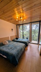 Postel nebo postele na pokoji v ubytování Cabaña La Finca Mazamitla