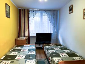 Postel nebo postele na pokoji v ubytování Apartament na Nowickiego