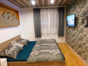 Ένα ή περισσότερα κρεβάτια σε δωμάτιο στο SKI Franková