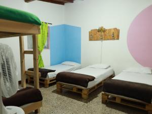 Postel nebo postele na pokoji v ubytování Hostal paz y vida