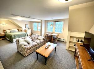 a living room with a couch and a bed at Peaceful Mtn Studio Pet-friendly in Woodstock