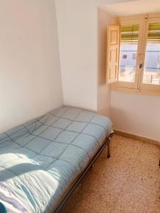 Ένα ή περισσότερα κρεβάτια σε δωμάτιο στο Casita Mezcal, in city center with great views