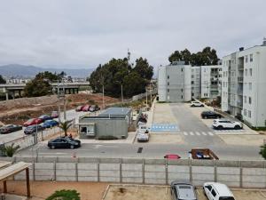 an aerial view of a parking lot in a city at Acogedor, cómodo y central. in La Serena