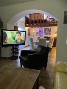 A television and/or entertainment centre at GITE CLARIMOR