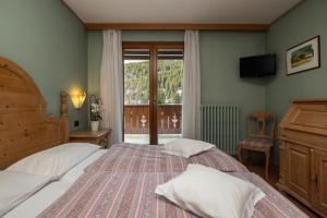 Ένα ή περισσότερα κρεβάτια σε δωμάτιο στο HOTEL GARNi NORMA