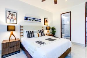 a bedroom with a large bed and a mirror at El Tigre, Mariposa Villas with Private Pool in Nuevo Vallarta  +34 photos