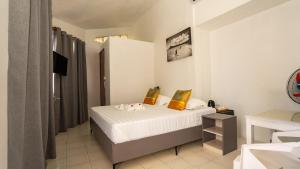 Uma cama ou camas num quarto em La Plage Residence