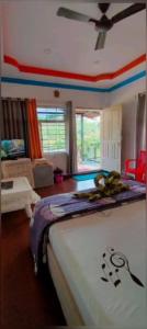 a bedroom with a bed in a room at Marigold Homestay in coorg in Madikeri