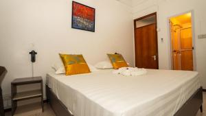 Uma cama ou camas num quarto em La Plage Residence