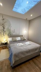 Postel nebo postele na pokoji v ubytování Apartamenty Piwniczna-Zdrój Rynek