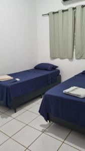 Katil atau katil-katil dalam bilik di Turys Hotel Pousada