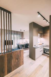 a kitchen and dining room with a table in it at LIVALPIN Comfort in Garmisch-Partenkirchen