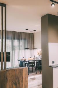 a kitchen and dining room with a dining table at LIVALPIN Comfort in Garmisch-Partenkirchen