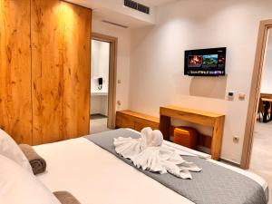 Postel nebo postele na pokoji v ubytování ANESSIS Villas and Suites