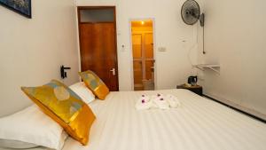 Uma cama ou camas num quarto em La Plage Residence