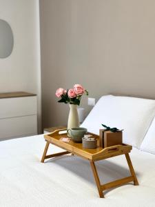 En eller flere senge i et værelse på Casa Vittoria - tra Lago Maggiore e centro città