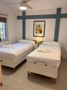 Postel nebo postele na pokoji v ubytování Villa Portitxol en Moraira