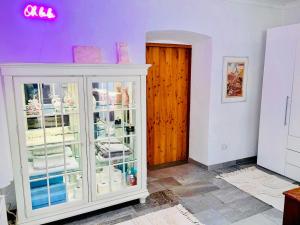 a room with a white cabinet and a wooden door at Farmhouse -Alter Sandwirt- in sunny Carinthia in Vorderberg +38 photos