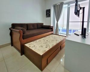 a couch in a living room with a table at Book Santos Unlimited 1216 - Vista Lateral do Mar in Santos +37 photos
