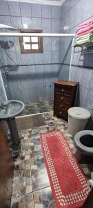 a bathroom with a sink and a toilet at Casa no centro aproveite o melhor de Foz in Foz do Iguaçu +19 photos