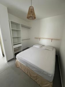Postel nebo postele na pokoji v ubytování Casa Caraïbe + 8 fotografií