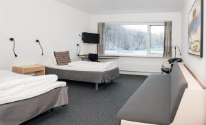 Postel nebo postele na pokoji v ubytování Vingsted Hotel & Konferencecenter