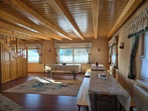 a large room with a ping pong table in it at Antal Villa - 5mins to ski slope & 1min to skating in Harghita-Băi