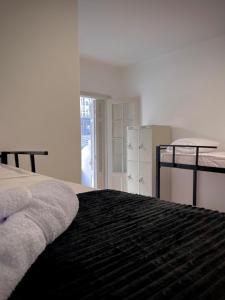 Urban Nomad Hostel and Food Av Paulista客房内的一张或多张床位