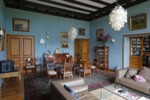 a living room with a couch and a table at BellevueBretagne - Chambres d'Hôtes in Saint-Jean-du-Doigt